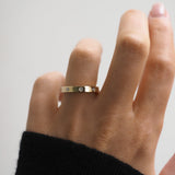 Flush Setting Wedding Band Featuring 0.12 TCW Round Moissanite 1