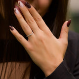 Curved Wedding Band Featuring 0.18 TCW Round Moissanite 9