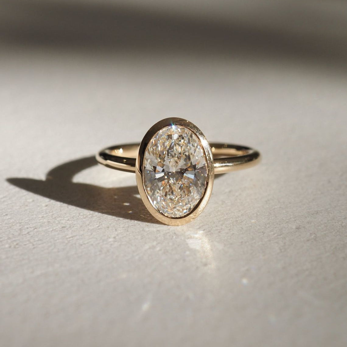 Bezel Setting Engagement Ring Featuring 1.5 CT Oval Moissanite 1