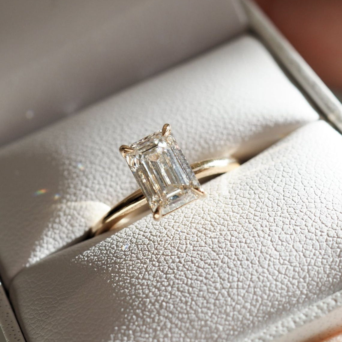 Solitaire Engagement Ring Featuring 1.5 CT Emerald Moissanite 1