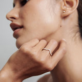 Curved Wedding Band Featuring 0.20 TCW Round Moissanite 1