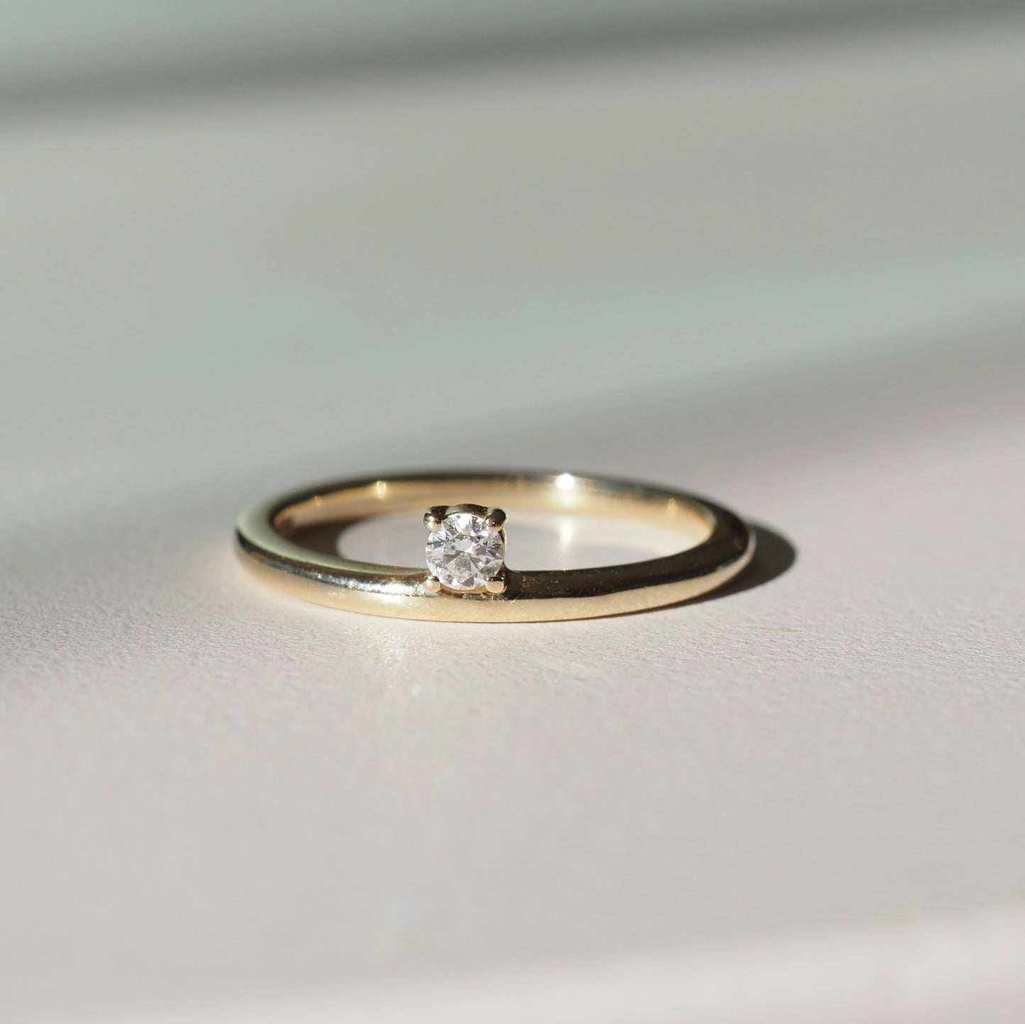 Offset Solitaire Engagement Ring Featuring 0.20 CT Round Moissanite 1