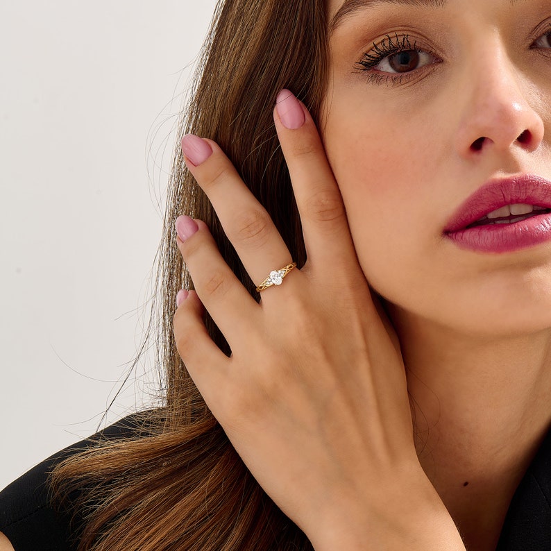 Cluster Engagement Ring Featuring 0.42 CT Oval Moissanite 1