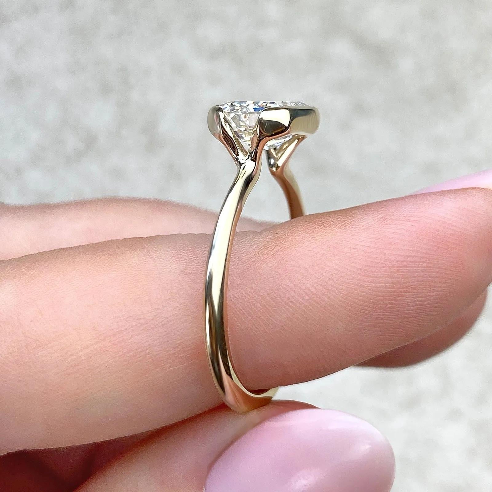Solitaire Bezel Engagement Ring Featuring 1.91 CT Emerald Moissanite 25