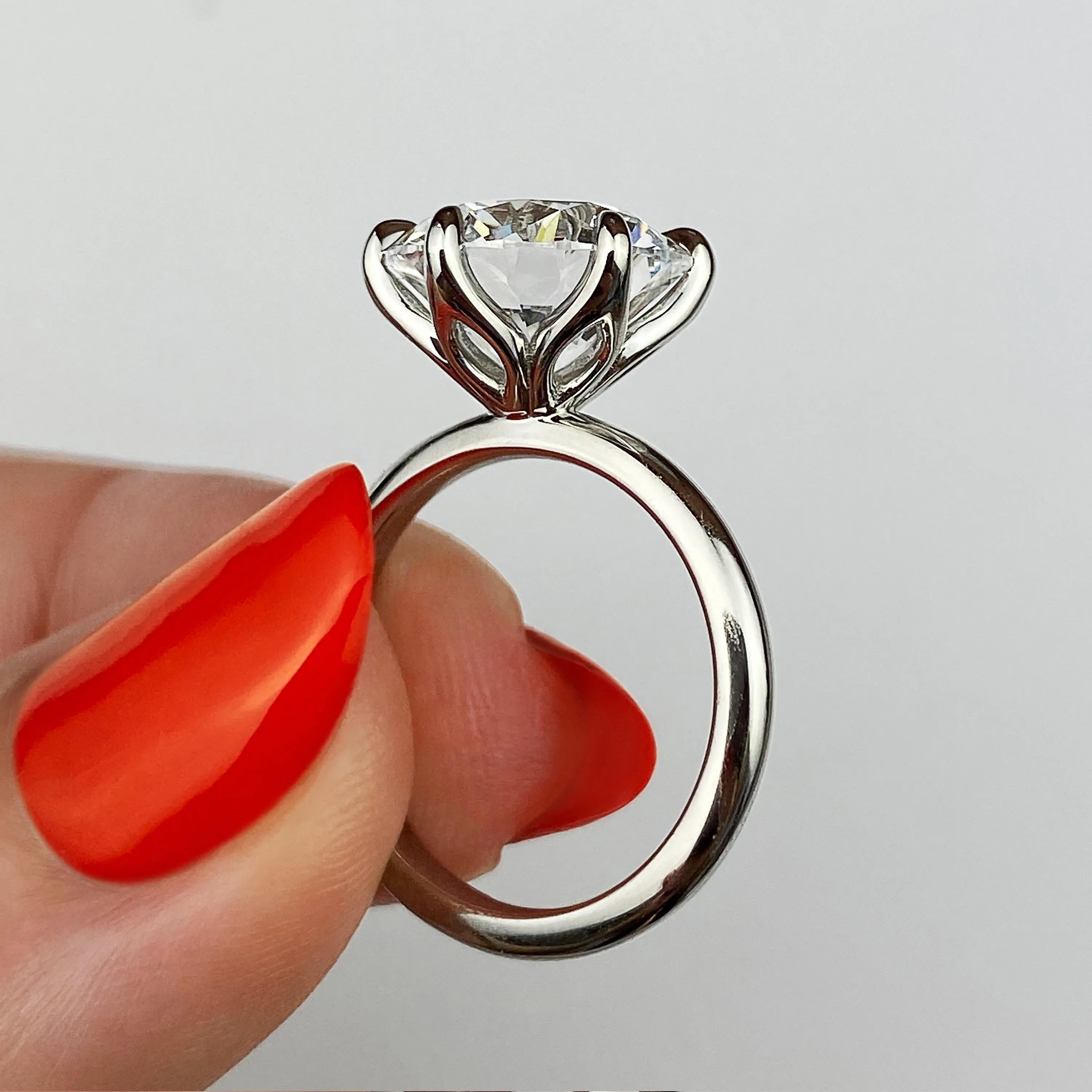 Solitaire Bezel Engagement Ring Featuring 1.35 CT Round Moissanite 24