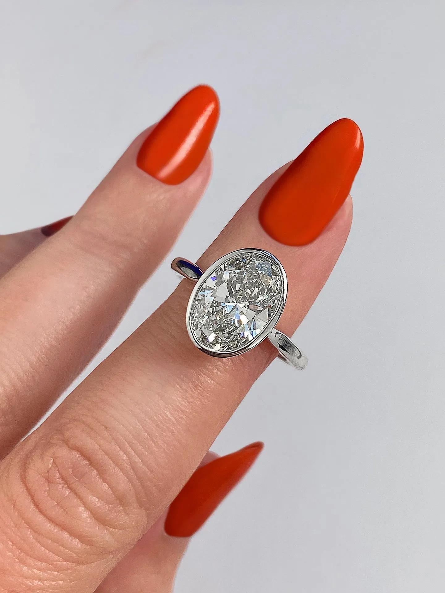 Solitaire Bezel Engagement Ring Featuring 1.91 CT Oval Moissanite 2