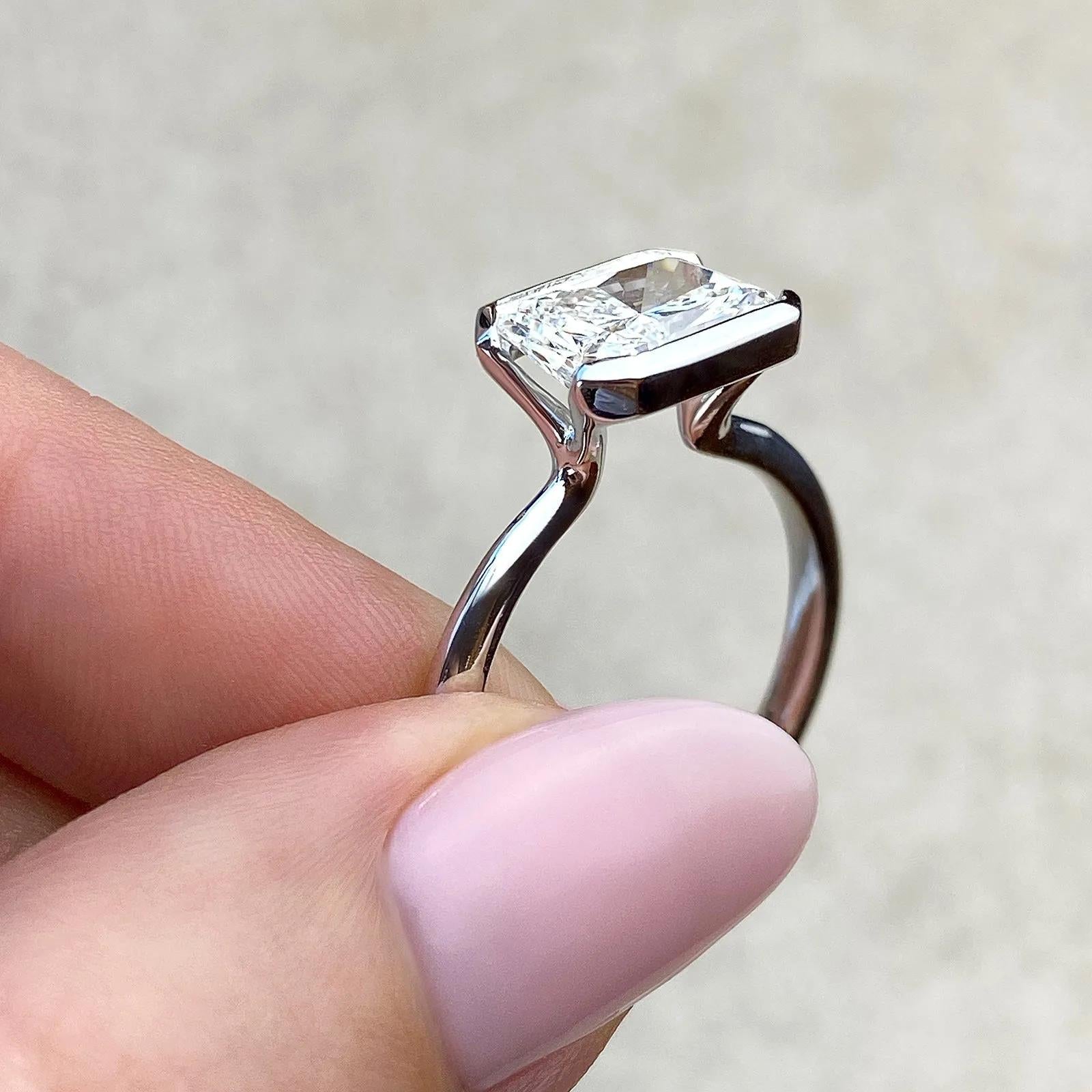 Solitaire Bezel Engagement Ring Featuring 1.91 CT Emerald Moissanite 23